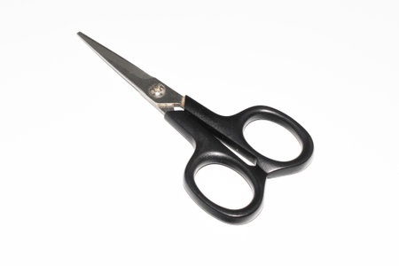 scissors with a black handle on a white backgroundの写真素材