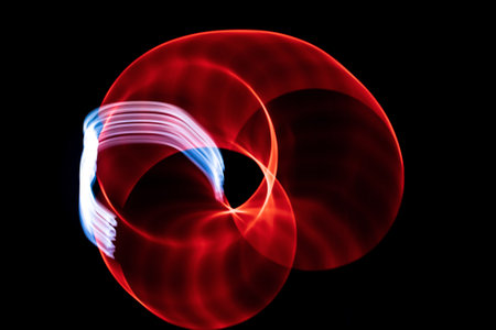 abstract red and blue lines on a black backgroundの写真素材