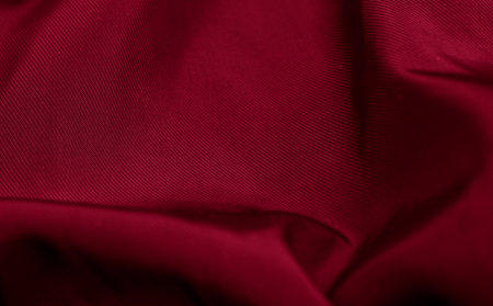 red crinkled cotton fabric with visible details. background