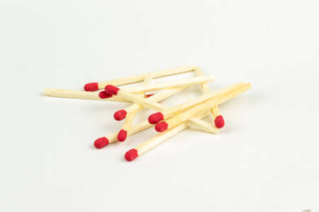 matchsticks with red sparks on a white background