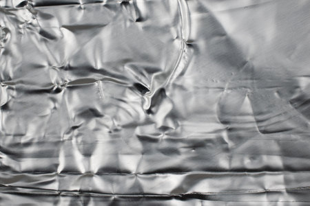 crumpled silver aluminum foil. background or textureの写真素材