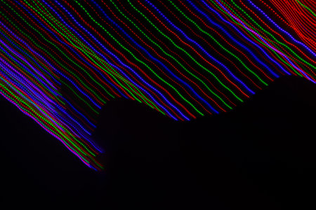 colored lines on a black backgroundの写真素材