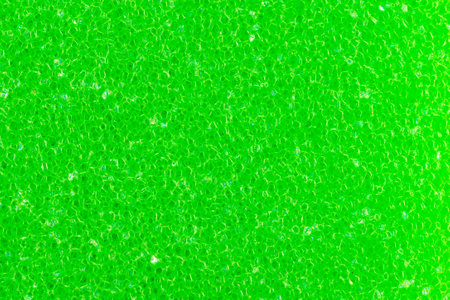 green dishwashing sponge with visible details. background or textureの写真素材