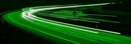 green car lights at night. long exposureの写真素材