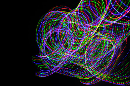 colored lines on a black background.texturaの写真素材