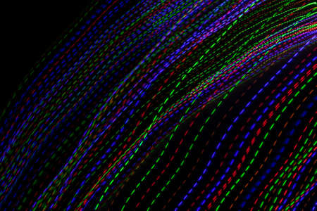 colored lines on a black background.texturaの写真素材