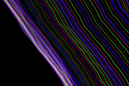 colored lines on a black background.texturaの写真素材