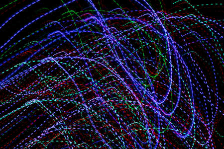 colored lines on a black background.texturaの写真素材