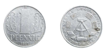 one german coin pfennig on a white isolated backgroundの写真素材