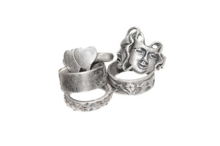 old silver rings on a white isolated backgroundの写真素材
