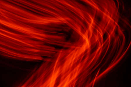 red luminous lines on a black backgroundの写真素材
