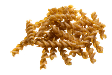 wholemeal pasta on a white isolated backgroundの写真素材