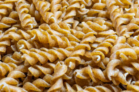 wholemeal pasta with visible details. background or texturaの写真素材