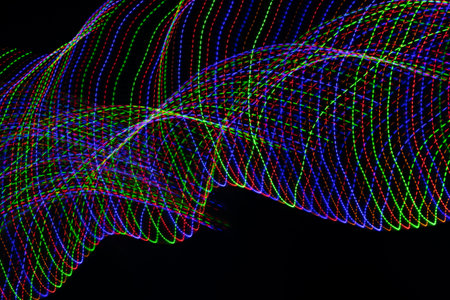 colored lines on a black background. texturaの写真素材