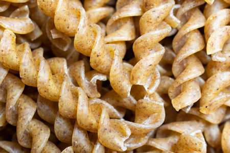 wholemeal pasta with visible details. background or texturaの写真素材