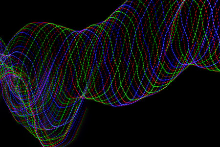 colored lines on a black background.texturaの写真素材