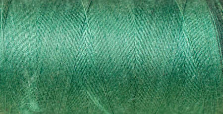 green cotton threads with visible details. backgroundの写真素材