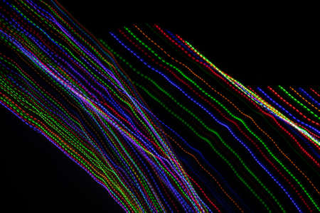 colored lines on a black background.texturaの写真素材