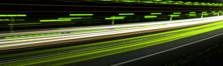 green car lights at night. long exposureの写真素材