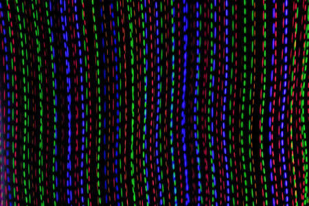 colored lines on a black background. texturaの写真素材
