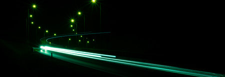 green car lights at night. long exposureの写真素材