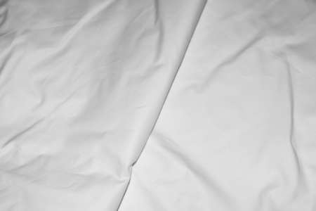 pleated white cotton material. texture or background