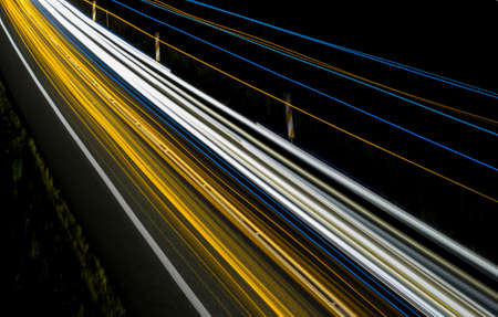 yellow car lights at night. long exposureの写真素材