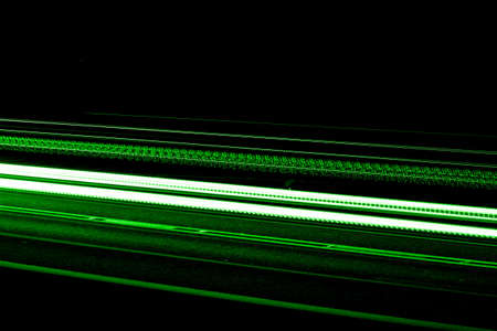 green car lights at night. long exposureの写真素材