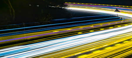 yellow car lights at night. long exposureの写真素材