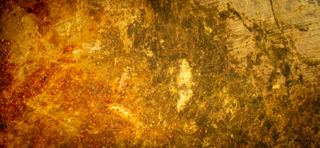 macro photo of metal plate in red and gold with visible texture. backgroundの写真素材