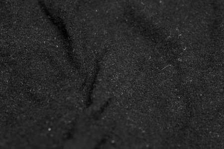 black crinkle cotton fabric with visible details. backgroundの写真素材