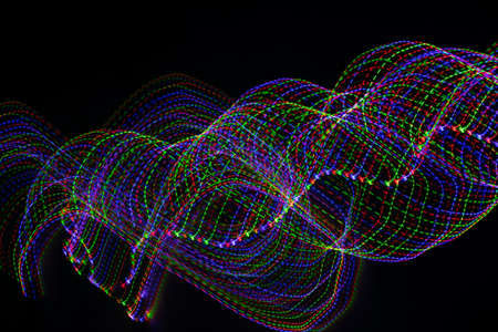 colored lines on a black background. texturaの写真素材