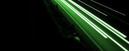 green car lights at night. long exposureの写真素材