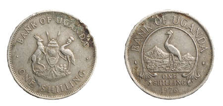 A Uganda coin shilling on a white isolated backgroundの写真素材