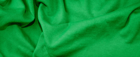 green cotton fabric with visible details. backgroundの写真素材