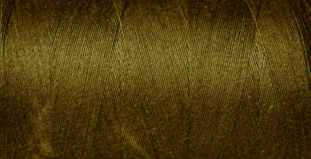 gold cotton threads with visible details. backgroundの写真素材
