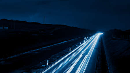 blue car lights at night. long exposureの写真素材