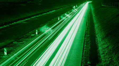 green car lights at night. long exposureの写真素材