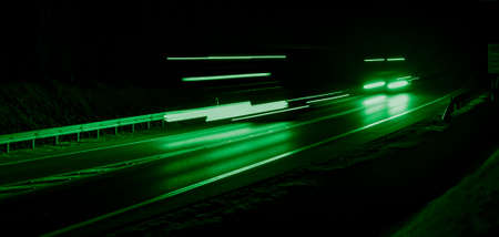 green car lights at night. long exposureの写真素材
