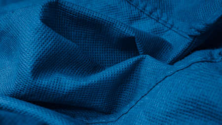 pleated blue cotton material. texture or backgroundの写真素材