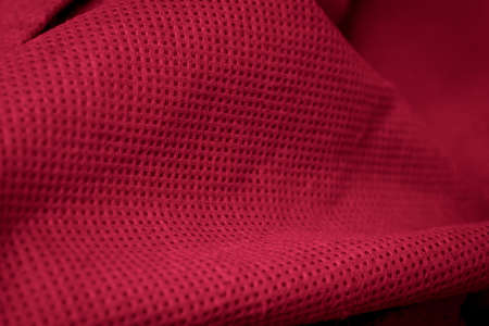 red cotton fabric with visible details. background or texturaの写真素材