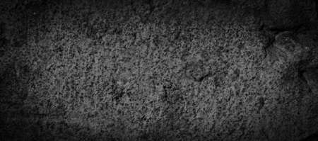 macro photo of black brick with visible texture. backgroundの写真素材
