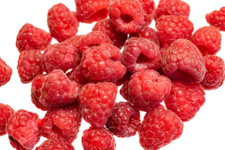 red raspberries on a white isolated backgroundの写真素材