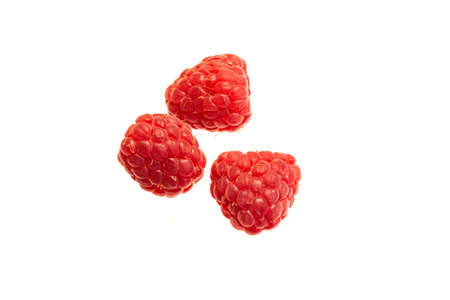 red raspberries on a white isolated background