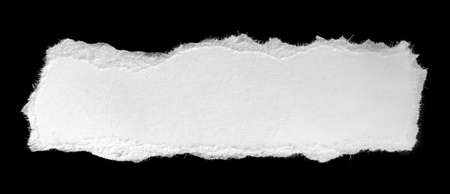 a white piece of paper on a black isolated backgroundの写真素材
