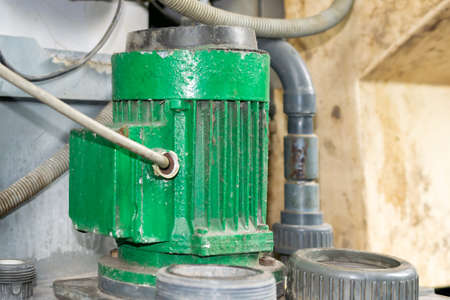 old electric motors powering machines in industryの写真素材