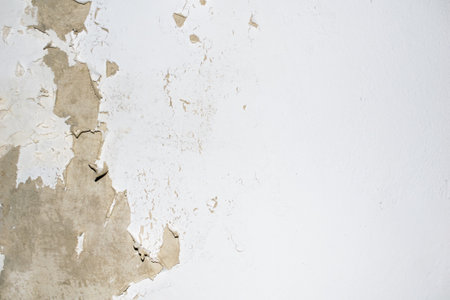 old wall with peeling white paint. backgroundの写真素材