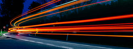 abstract red car lights at night. long exposureの写真素材