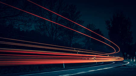 abstract red car lights at night. long exposureの写真素材