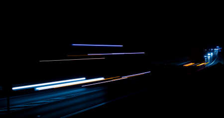 abstract red car lights at night. long exposureの写真素材